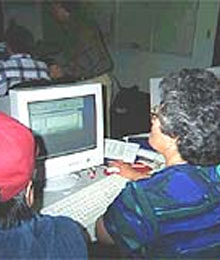 Bureau of Indian Affairs employees work on a trust fund computer system. File Photo BIA.