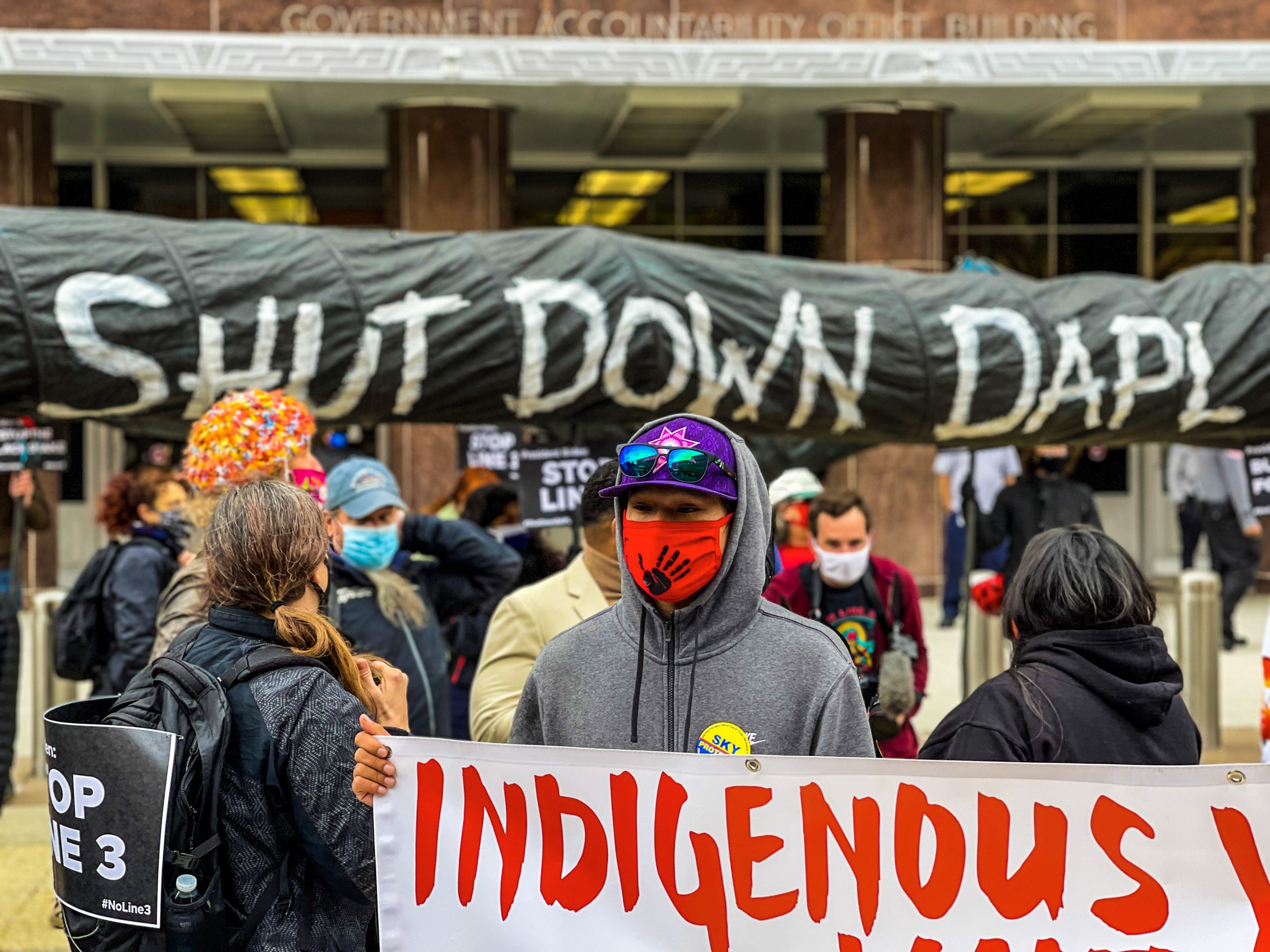 ‘Shut down DAPL’: Lakota youth bring black snake to Biden’s front door